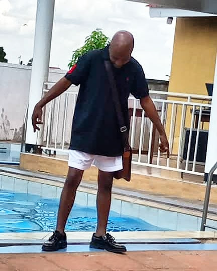 bryan morel at swimming pool looking casual