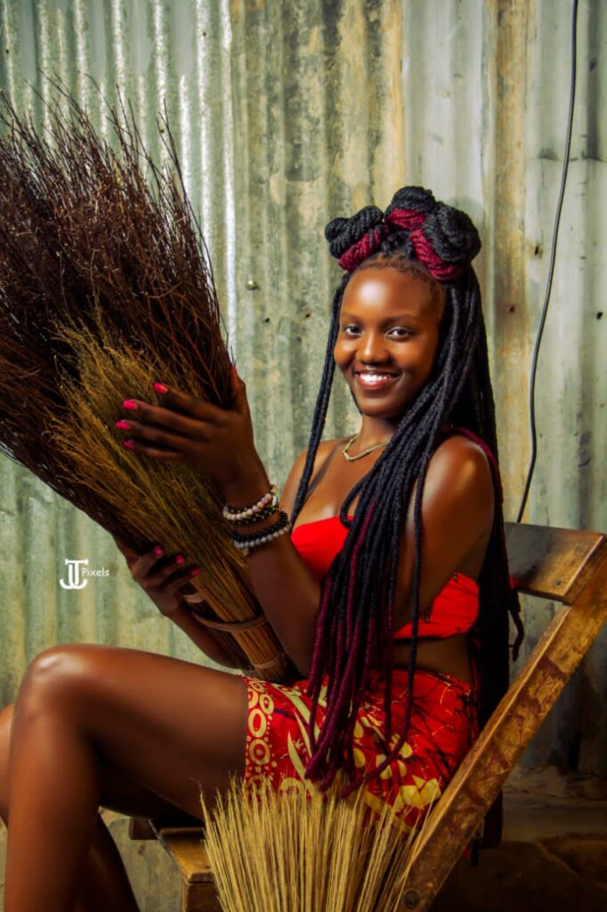 Stephanie Apila holds brooms in teso