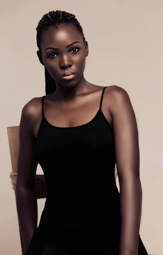 beautiful black skin girl in black dress and nice lip gloss