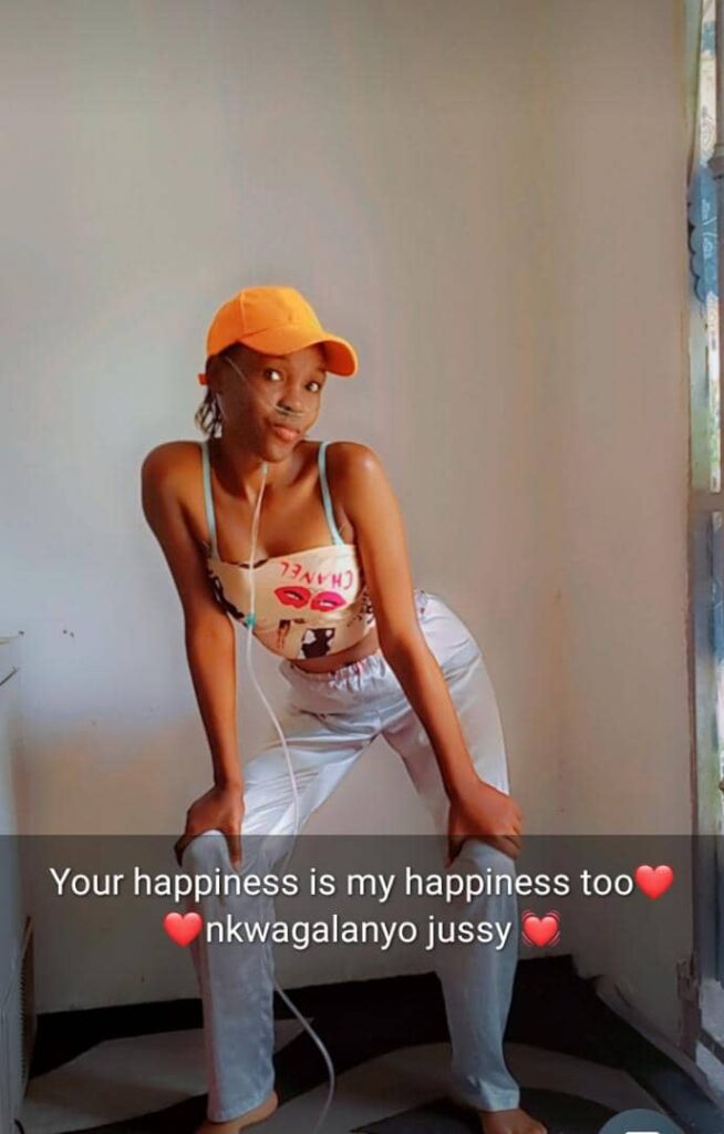 justine mukisa wearing a cancer tube