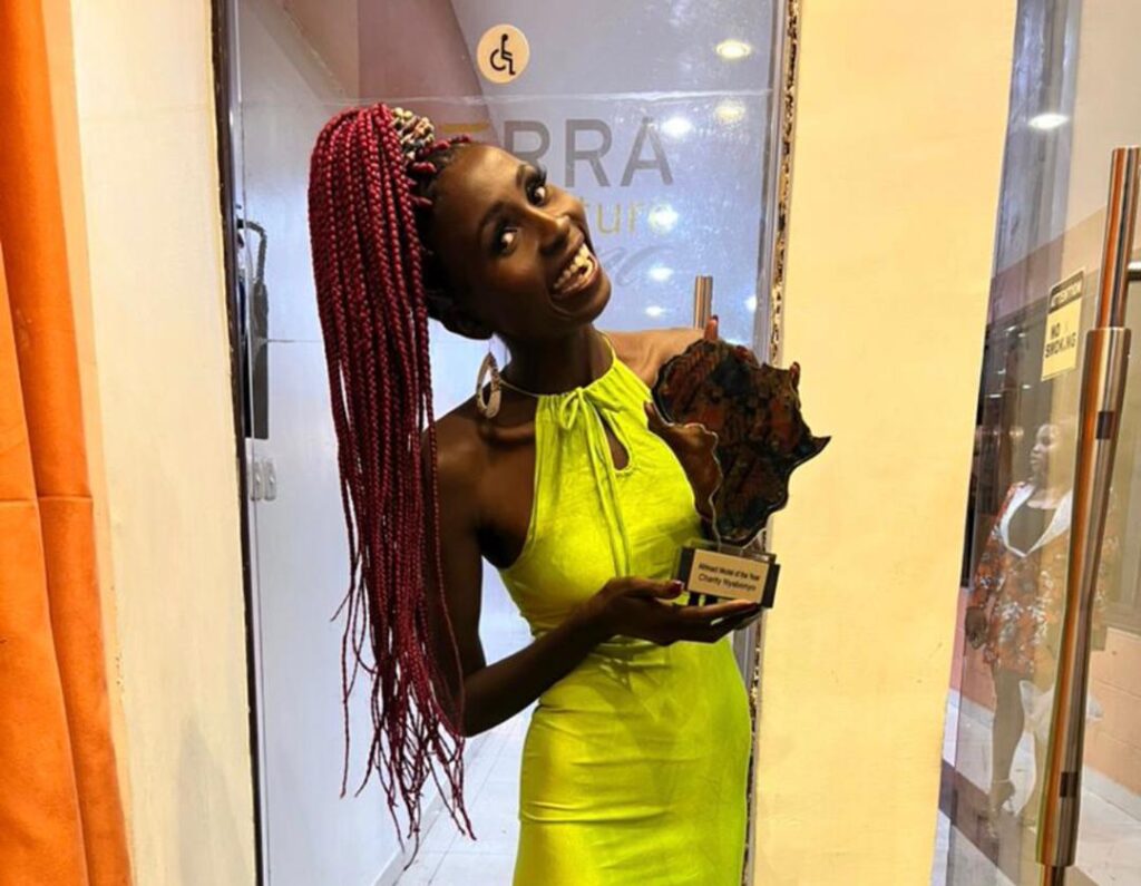 Nyabonyo Anna Wins AFRIMACT Model Of The Year In Nigeria 7 nyabonyo anna charity wearing a yellow dress