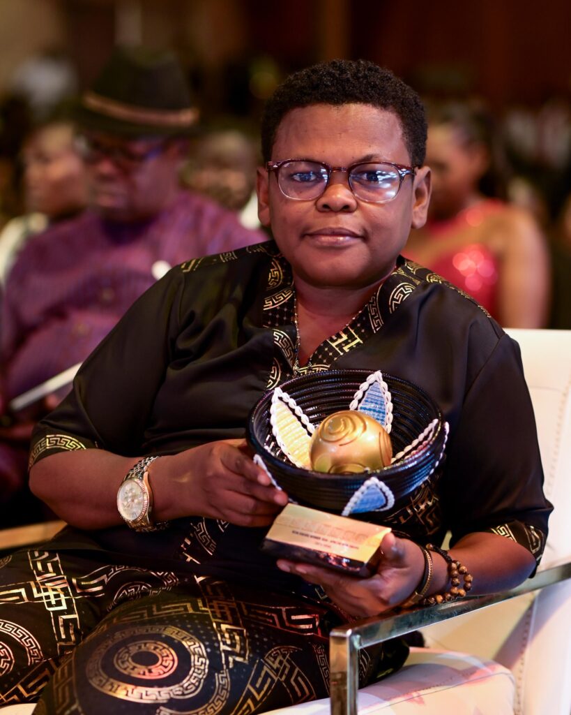 Iheme osita holding his award