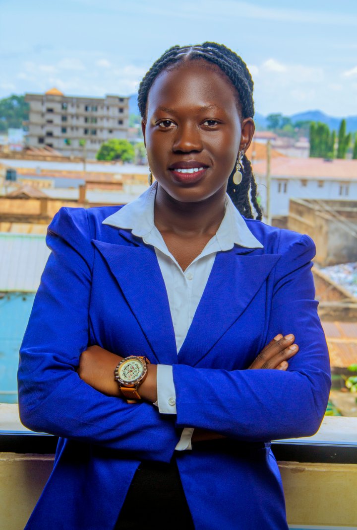 Rita Alobo wearing a blue suit