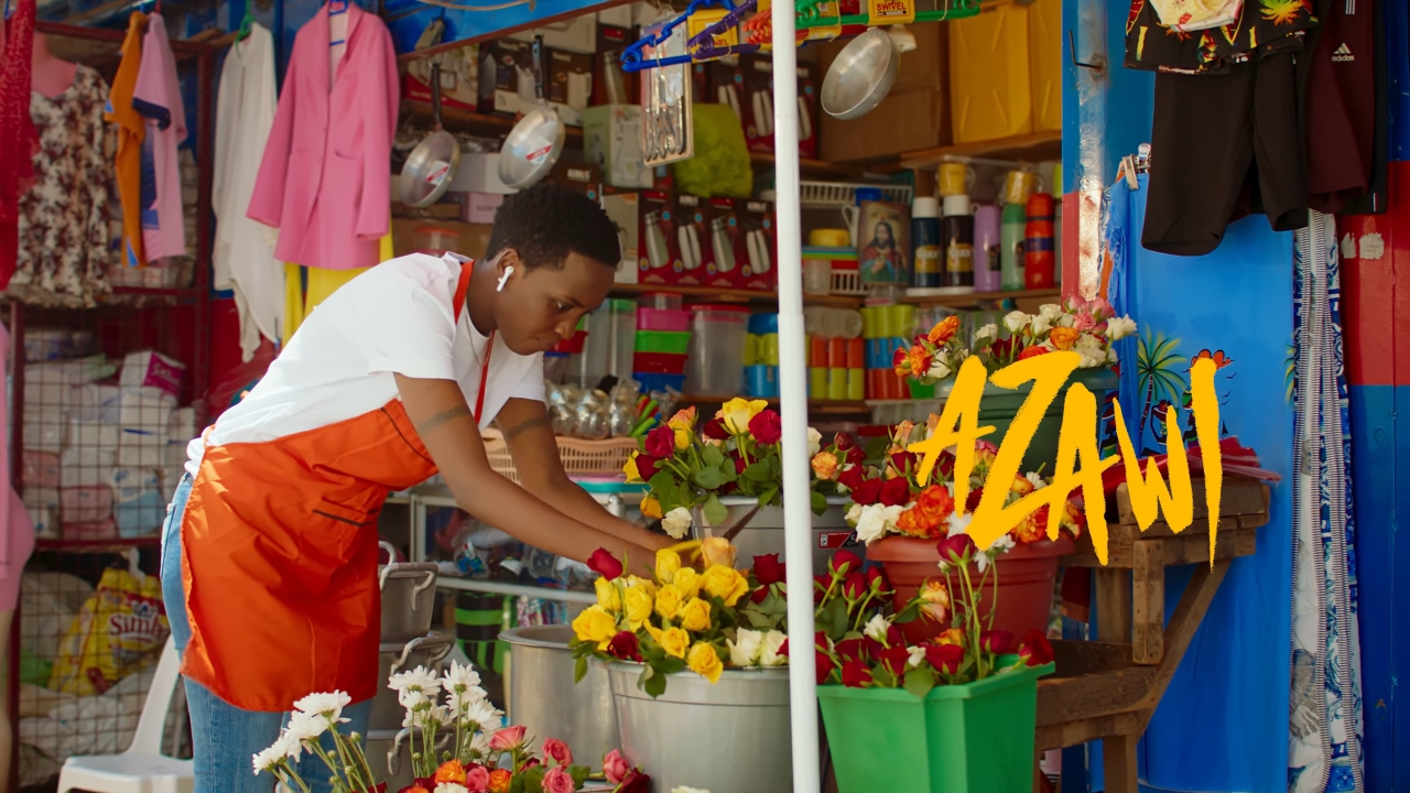 Azawi as a tailor and fashion designer for Kitenge