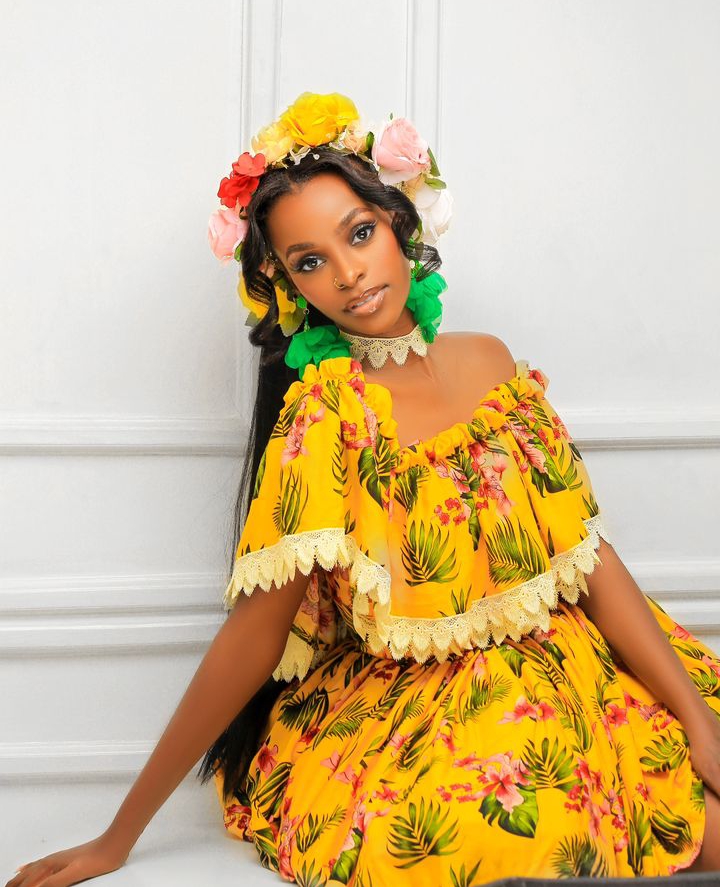 Hellen Lukoma in yellow dress