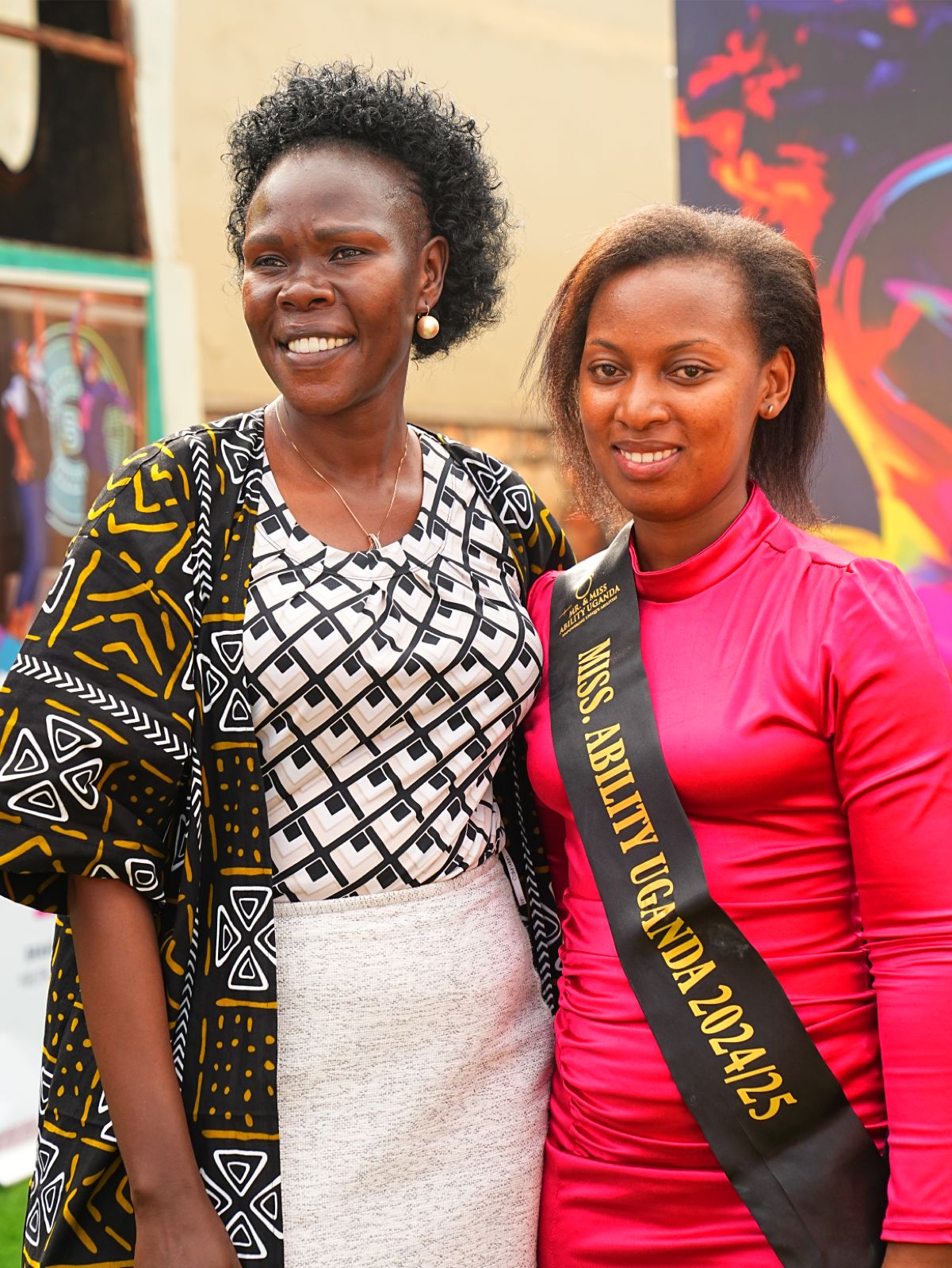 Evelyn Anite poses for a photo with Miss Ability Uganda