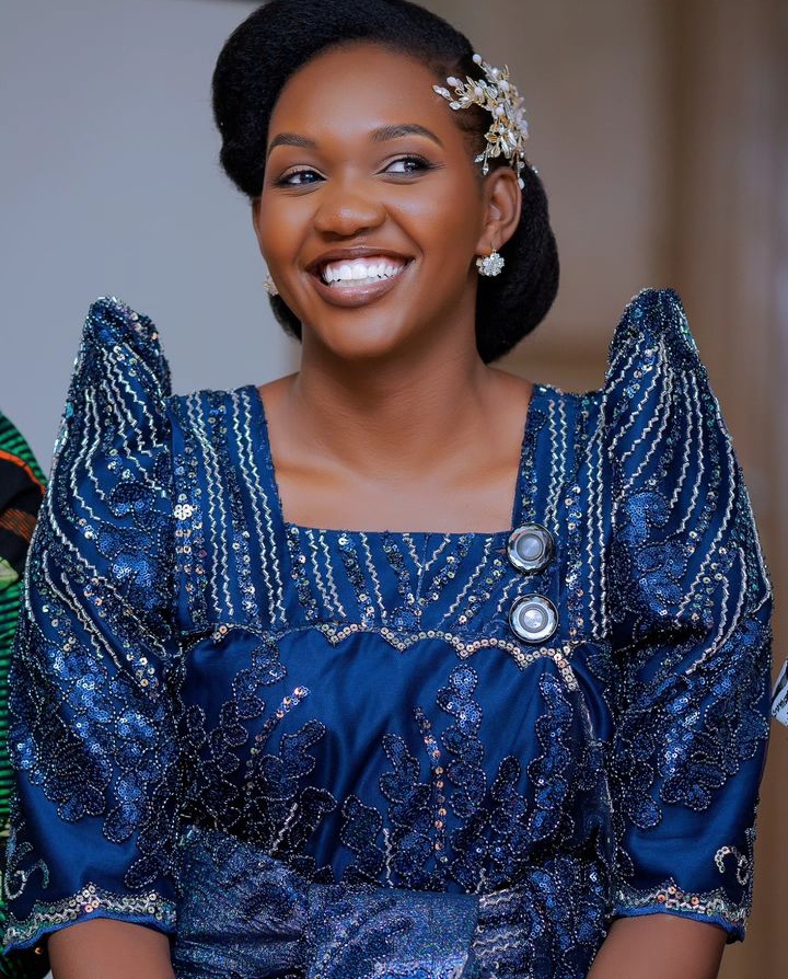 Phiona Nyamutoro dressed in blue gomesi