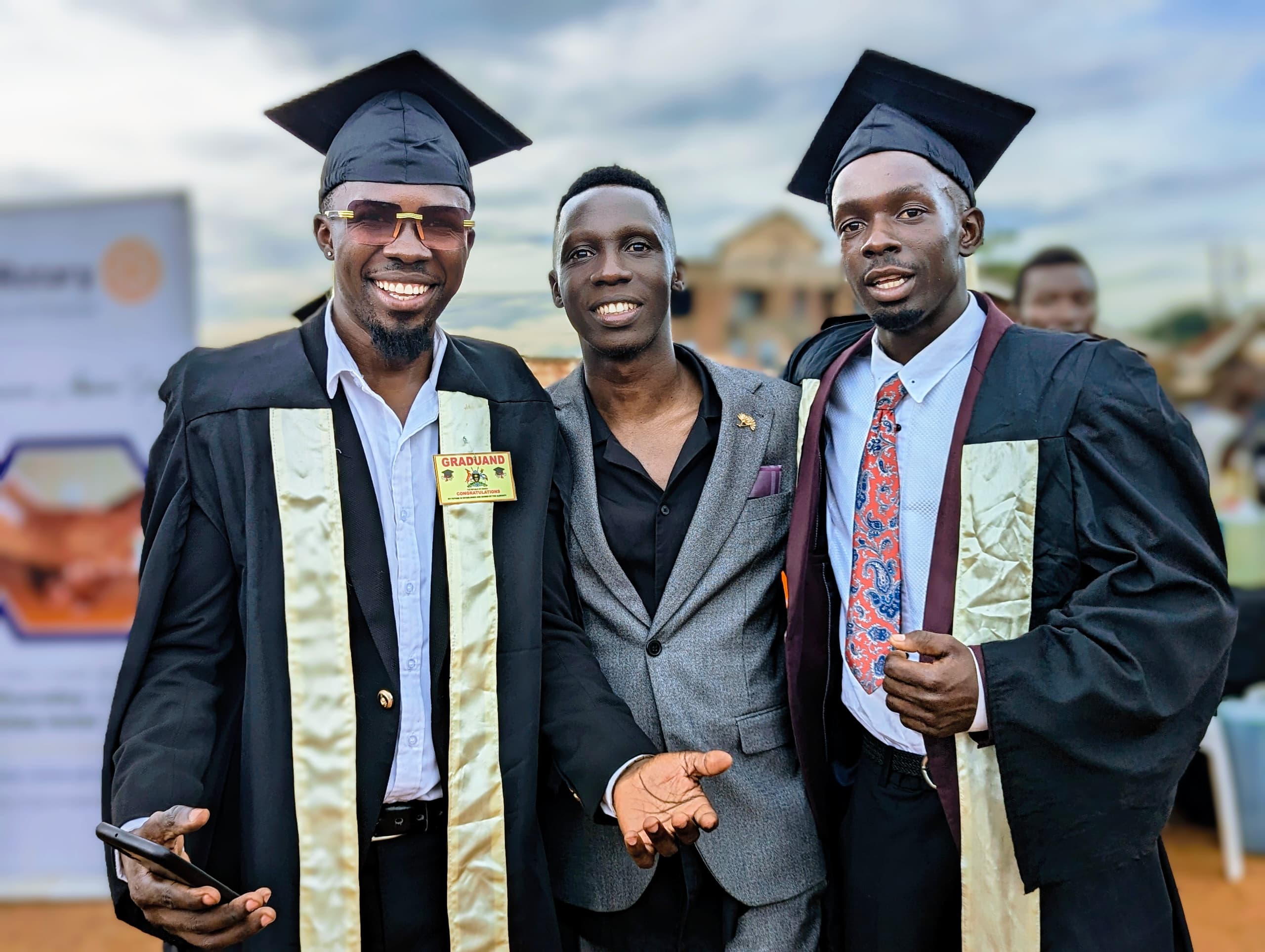 MC Galaxy Mfalme and Douglas Lwanga during graduation