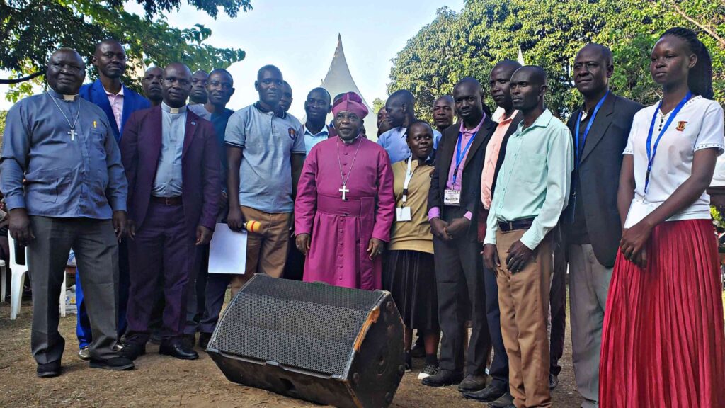 The Bishop of Bukedi Diocese ( centre ) taking a group photo with the Diocesan Youth Leaders 