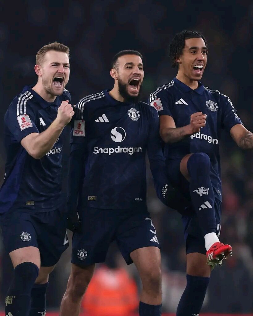 Manchester United players celebrate against Arsenal at FA Cup